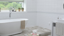 Pose d'une douche et lavabo dans une salle de bain  